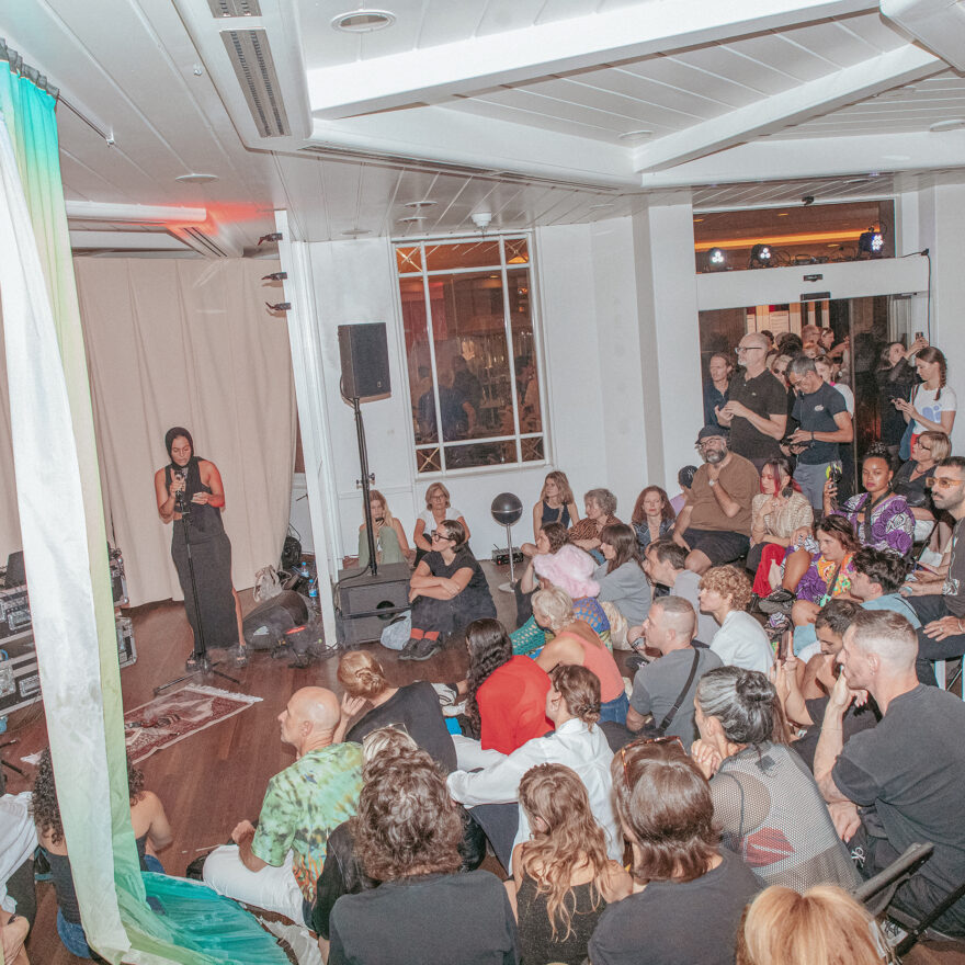 view into a room full of people watching a performance by Anna Ehrenstein, Göksu Kunak, Yara Mekawei